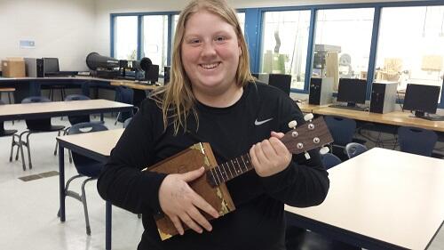 Student with home-made guitar