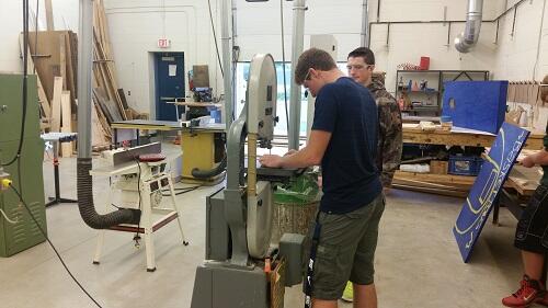 Student using a bandsaw